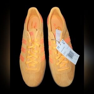 Mens adidas Originals Bermuda Sneakers Real Gold & Solar Orange" colorway.